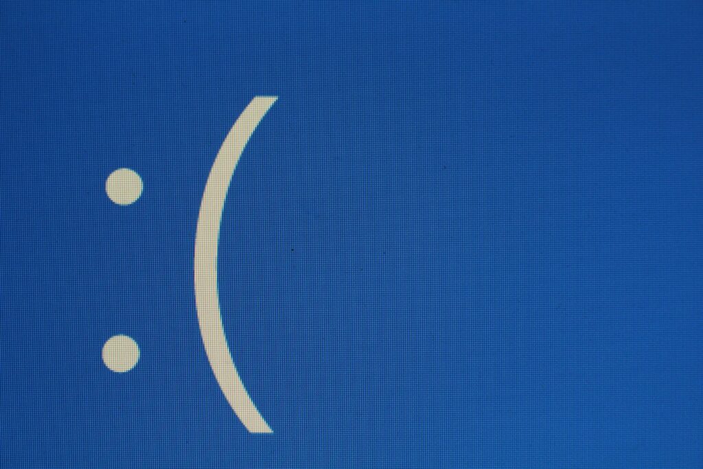 blue screen frowning face